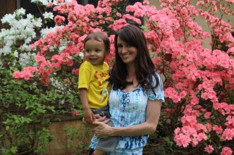 Amy and child in garden waiting for adoption