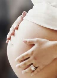 pregnant woman holding belly